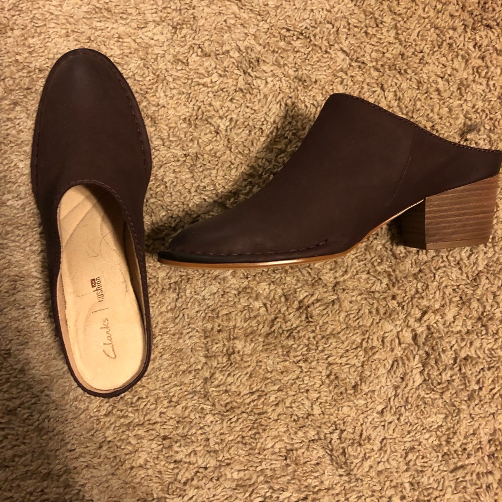 Clark’s mules brand new.